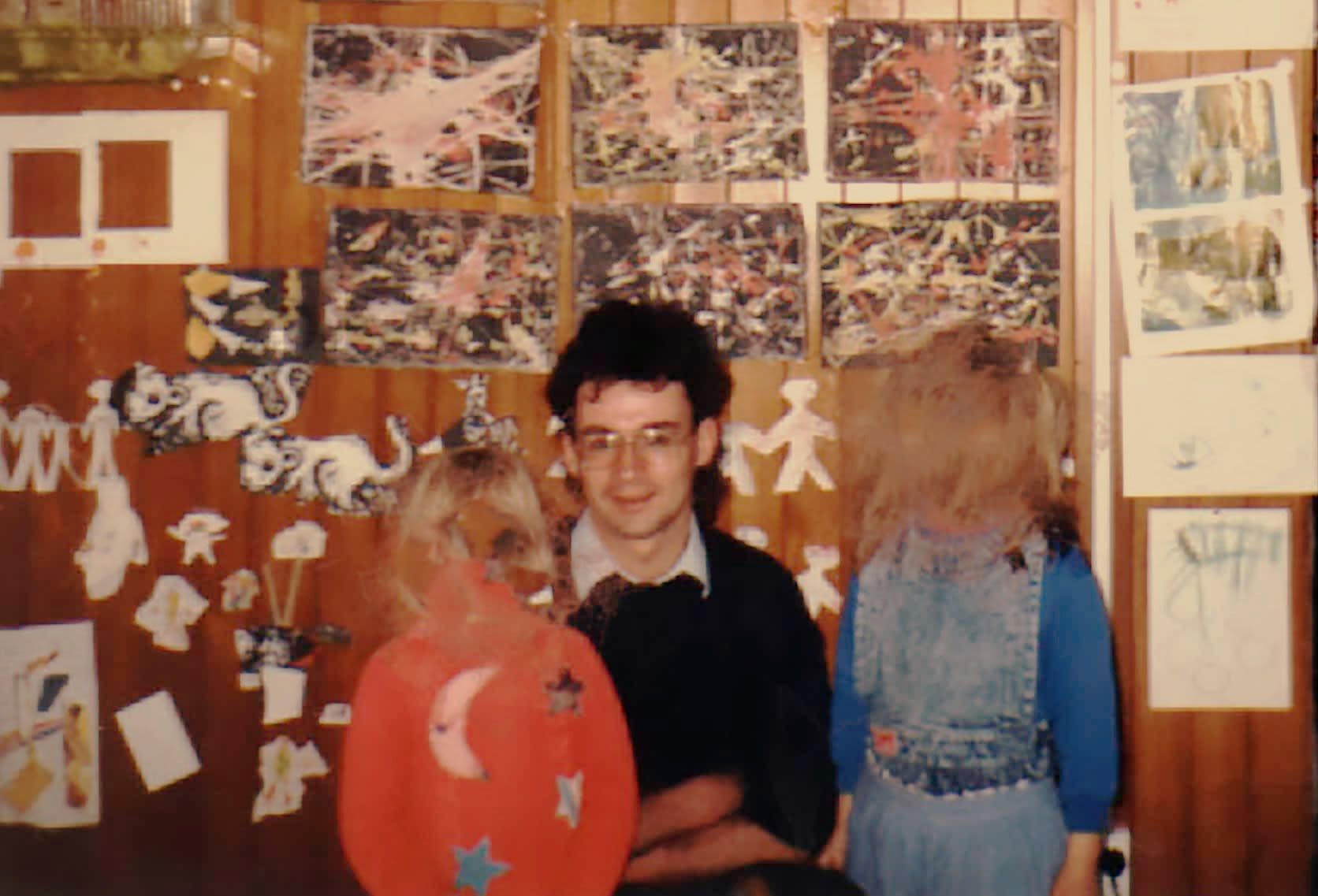 Peter Ellis with two children at the Christchurch Civic Creche. Children's faces are blurred